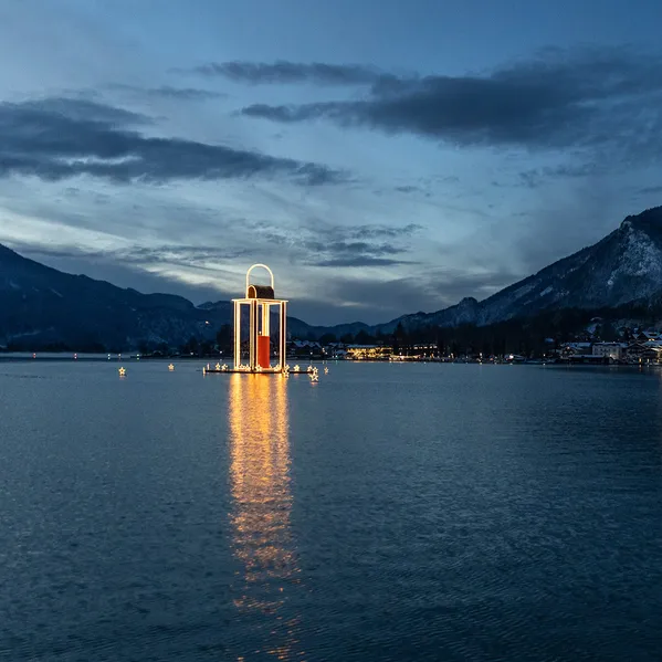 St. Wolfgang village and illuminated Christmas lantern on Lake Wolfgang at twilight